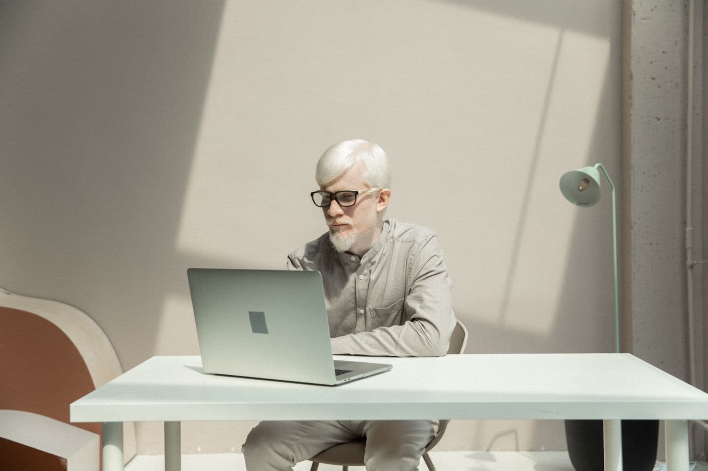 A marketing specialist managing a local business's online directory listings on a laptop